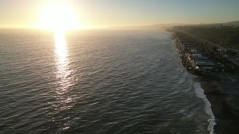 Golden Hour beach homes waves Stock Footage 249376762