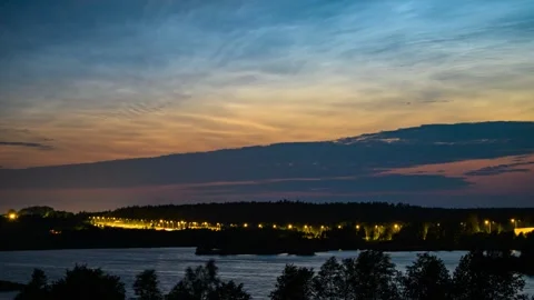 Golden hour dramatic orange sky, silver clouds. Stock Footage 313648999
