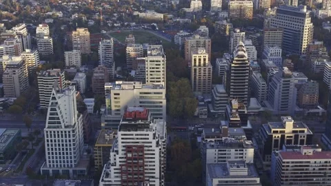 Golden hour drone drift over distinctive Apoquindo towers Santiago Chile Vídeos de archivo 334683261
