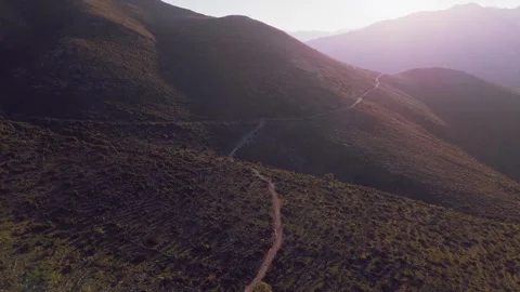 Golden Hour Drone Flight Over Remote Mountain Road in Greece Stock Footage 337864899
