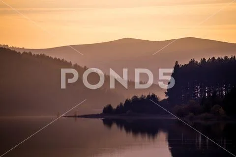 Golden hour landscape in Studena dam. Water level is restored in 2020 after been Stock Photos