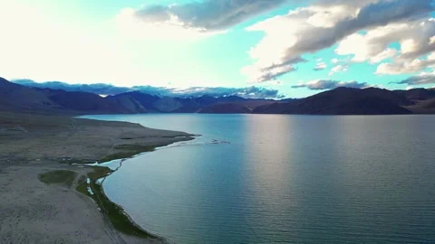 Golden hour magic over the surreal blue waters of Pangong Lake, viewed from Stock Footage 310898981