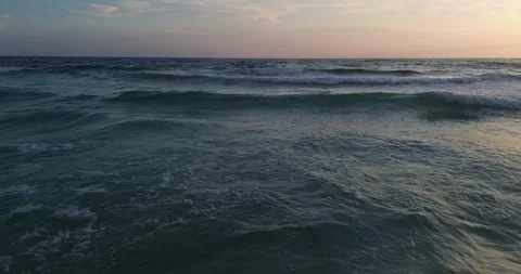 Golden Hour Ocean Waves Under Serene Sunset Stock Footage 323370810