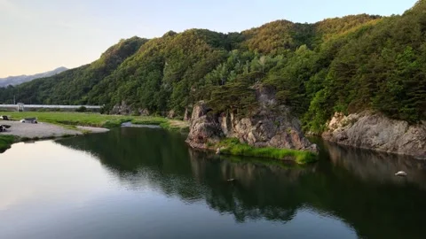 Golden Hour Orbit Drone Shot of Rock Island and River, South Korea Stock Footage 346233734