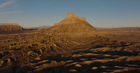 Golden Hour Pullback of Factory Butte Utah Badlands Landscape Stock-Footage 333832514