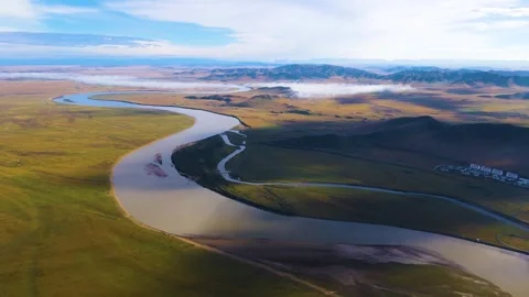 Golden Hour Reflections on River Surface with Grazing Yaks Stock Footage 304314107