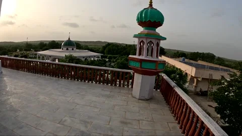Golden Hour Rooftop View of Modern Islamic Shrine with Green Dome Stock Footage 341323813