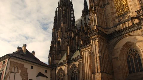 Golden hour shot of the outer facade of St. Vitus Cathedral in PRAGUE, Video stock 119597637