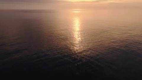 Golden Hour Sun Reflected on Calm Sea Surface off Porto Cervo, Sardinia Stock Footage 341066908