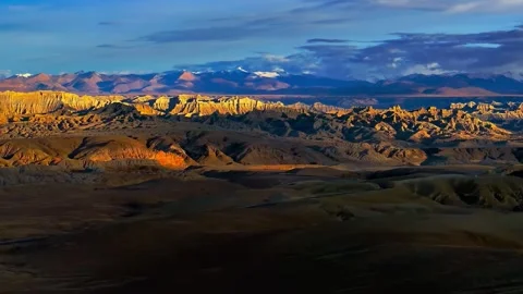 Golden Hour Sunlight on Eroded Mountain Range and Valley Tibet China Stock Footage 346737442