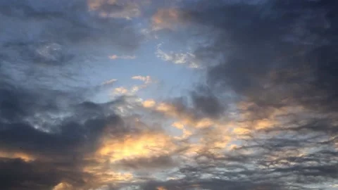 Golden hour sunset and clouds moving from the top of the building terrace Stock Footage 131357948