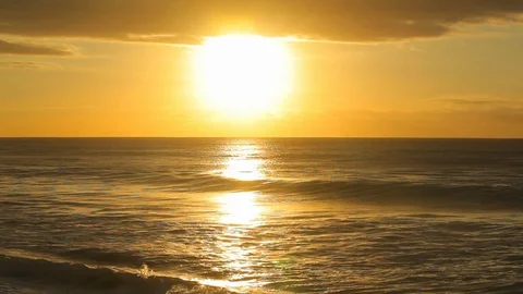 Golden hour sunset with bright reflection over romantic evening ocean B Stock Footage 120400185