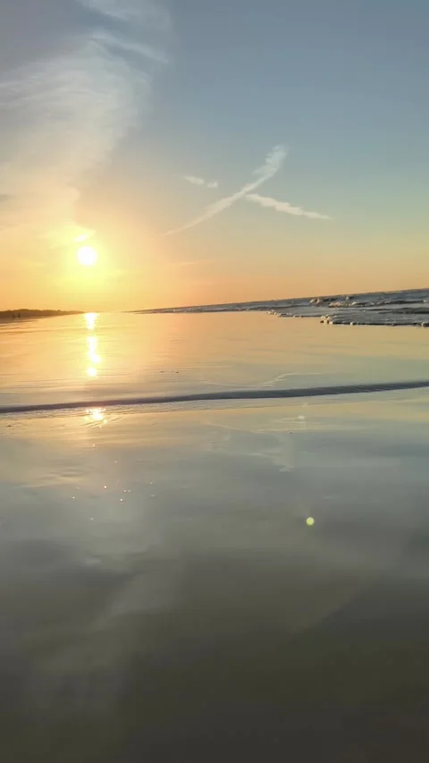 Golden Hour Sunset over Ocean Waves on Sandy Beach Vertical Stock Footage 340381602