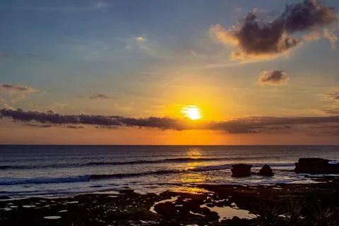 Golden hour sunset view from a sea beach. Stock Photos