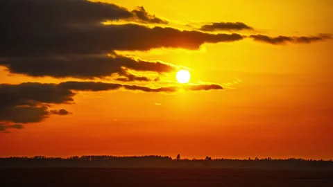 Golden Hour Timelapse of Sunset with Dramatic Sky and Clouds Over a Serene Stock Footage 300251383