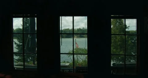 Golden Hour View O fLake Through Cottage Window Stock Footage 247854538