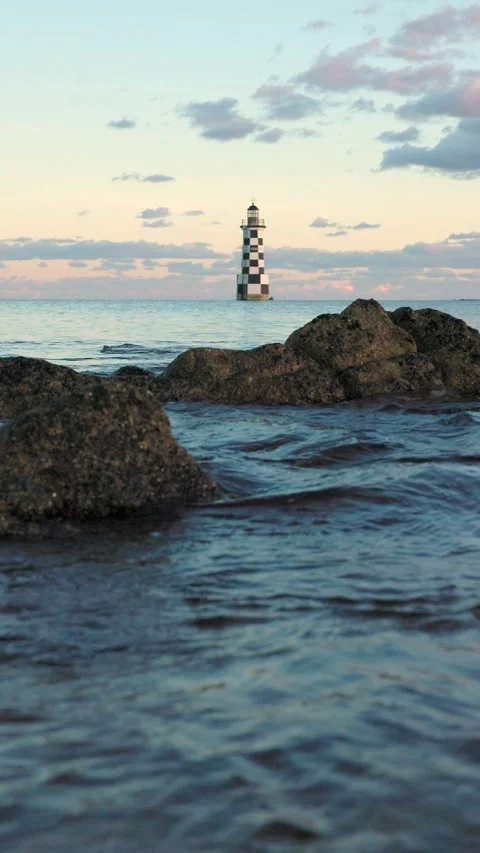 Golden Hour Waves at Brittany Lighthouse Stock Footage 321756341
