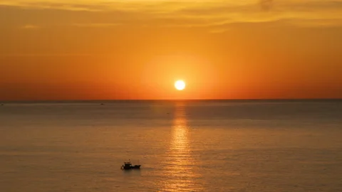 A Golden Idyllic Sunset. The Sun Sets Into The Waters of The Gentle Ocean Stock Footage 232766743