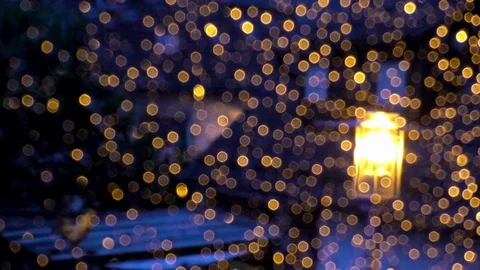 Golden, illuminated raindrops on a windowpane, window glass, bokeh, street light Stock Footage 79490985