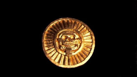 Golden image of Aztec god of death (mictlantecuhtli). In man's hands Stock Footage 69767897