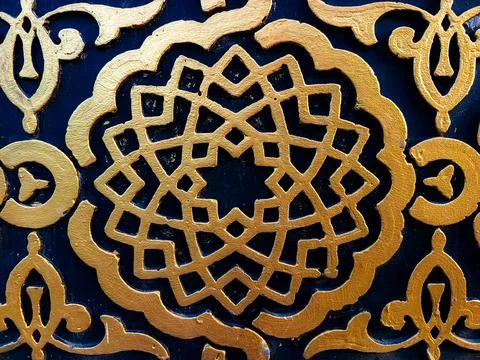 Golden Islamic Geometric Pattern on Blue Decorative Mosque Wall Stock Photos
