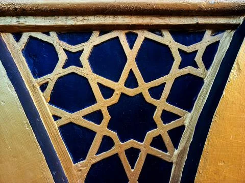 Golden Islamic Geometric Pattern on Blue Decorative Mosque Wall Stock Photos