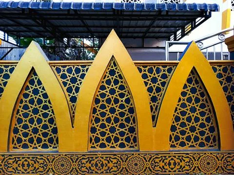 Golden Islamic Geometric Pattern on Blue Decorative Mosque Wall Stock Photos