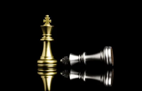 Golden king chess standing and silver king chess falling for the winner Stock Photos