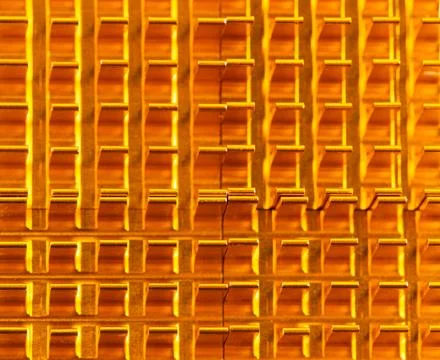 Golden lattice pattern gleams under warm light Stock Photos