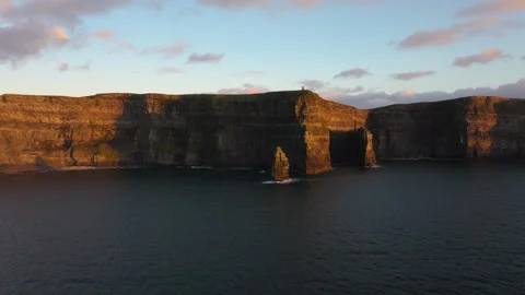 Golden Light Bathes Cliffs of Moher in Ireland&amp;#039;s Coastal Beauty Stock Footage 331825514