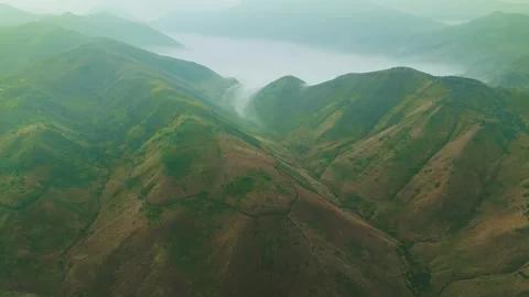 Golden light bathes rugged mountain ridgelines Stock Footage 341300982