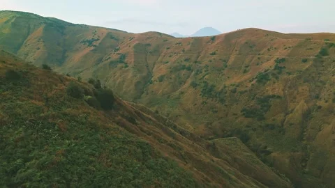 Golden light bathes rugged mountain ridgelines Stock Footage 341301975