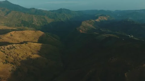 Golden light bathes rugged mountain ridgelines Stock Footage 341303341
