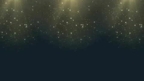 Golden light beams shining down on dark background with sparkling particles Video stock 336591143