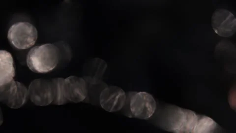 Golden light bokeh background video in a row in the dark of the night 스톡 동영상 318362948