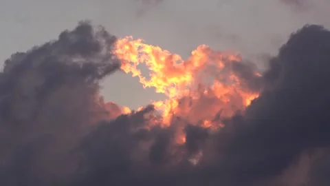 Golden light bursts through dark clouds Stock Footage 342025318