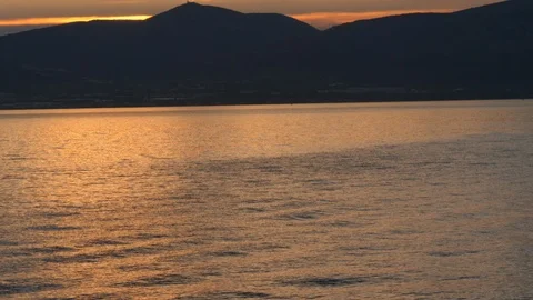 Golden Light On Ocean Waves From Floating Boat Stock Footage 119293550