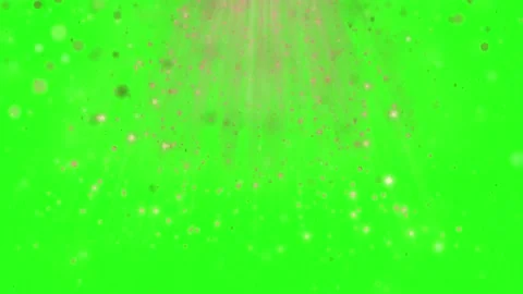 Golden light particles falling down on a bright green screen background for Stock Footage 342895533