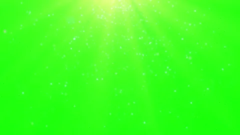 Golden light rays with floating dust particles over a vivid green screen Видео 344712656