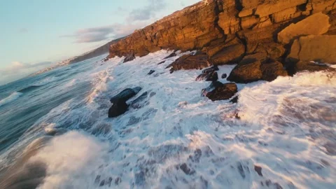 Golden light spills over rugged cliffs Stock Footage 340914693