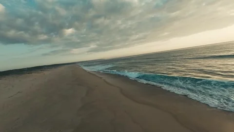 Golden light sweeps over tranquil beach Stock Footage 340227483