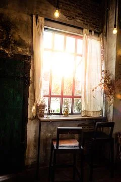 Golden light through window inside room in the morning. Hommie  house design. Stock Photos