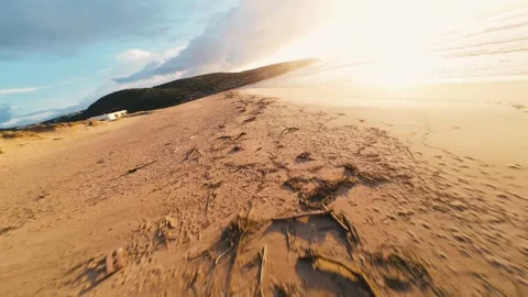 Golden light washes over sandy shorelines Stock Footage 340914010