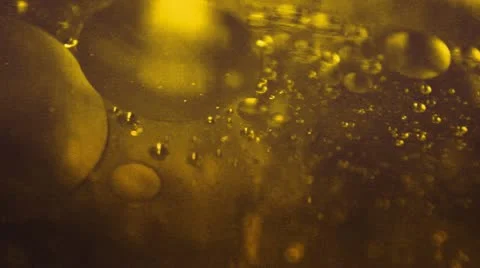 Golden liquid with bubbles Stock Footage 20664681