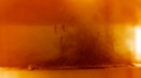 Golden liquid full of orange particles 库存影片 35913755