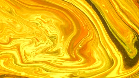 Golden liquid marble texture swirling in motion. Abstract flowing waves with glo Stock Footage 340456874