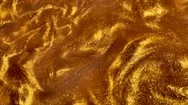 Golden Liquid Texture. Seethe Fluid. Yellow Red Black White Background. Stock Footage