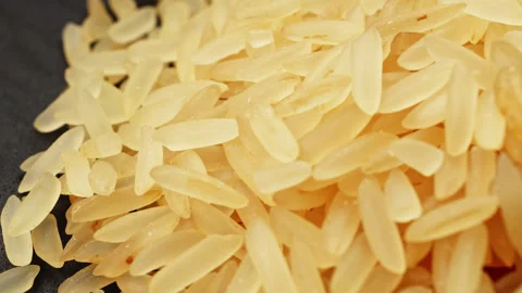 Golden long grain rice macro close up presentation slowly rotating stock fo.. Stock Footage 344857357
