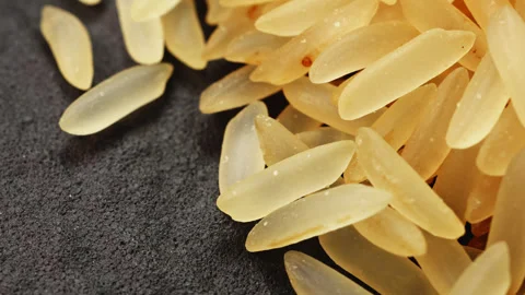 Golden long grain rice macro close up presentation slowly rotating stock fo.. Stock Footage 344858286