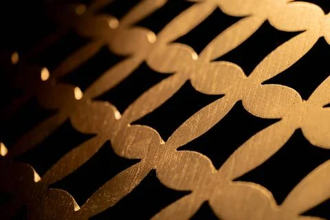 Golden metallic interlocking pattern close-up Stock Photos
